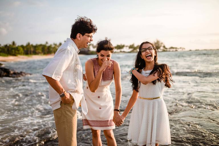 Family laughing on a beach
