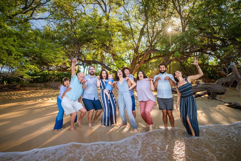 Family celebrating on a beach in Hawaii